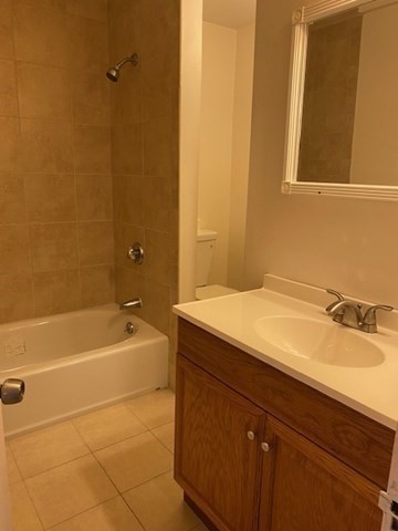 45 Webster Street, Unit 2 Woburn, MA 01801 - Photo 7 of 10 a bathroom with a sink and a bathtub