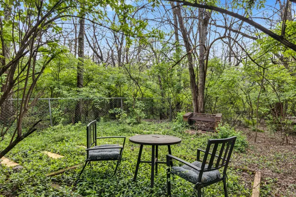 a view of a chairs in a backyard