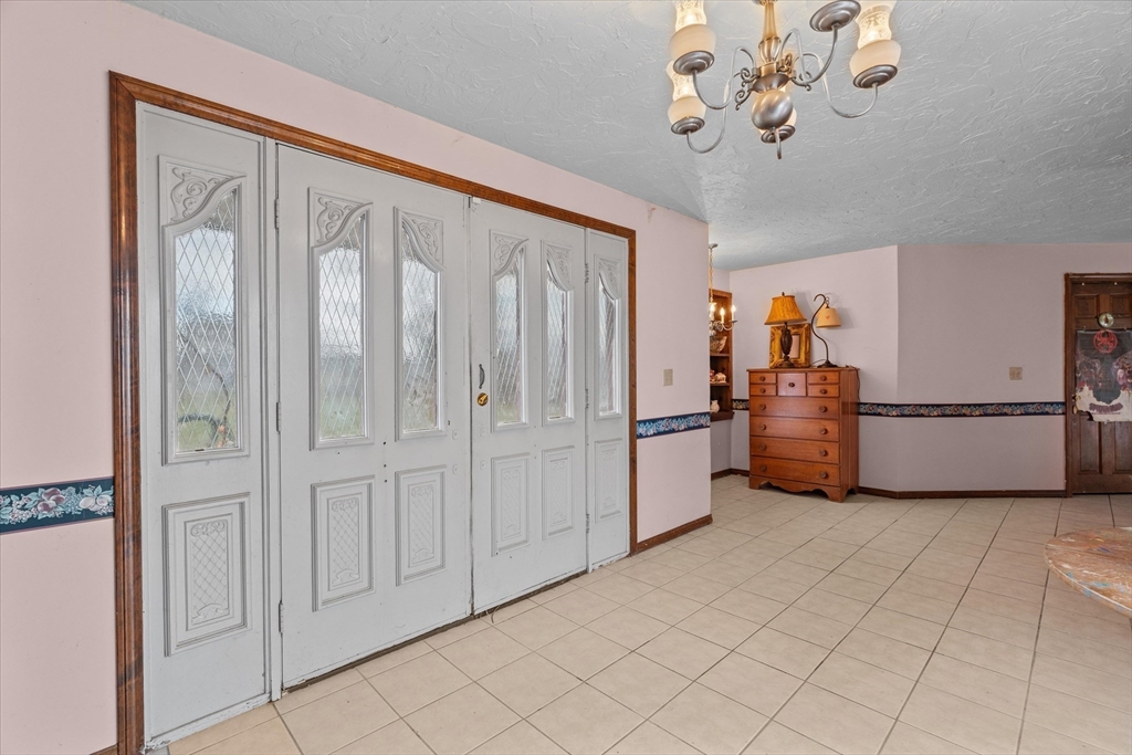 186 8 Lots Road Sutton, MA 01590 - Photo 13 of 33 a view of a storage & utility room with a fridge