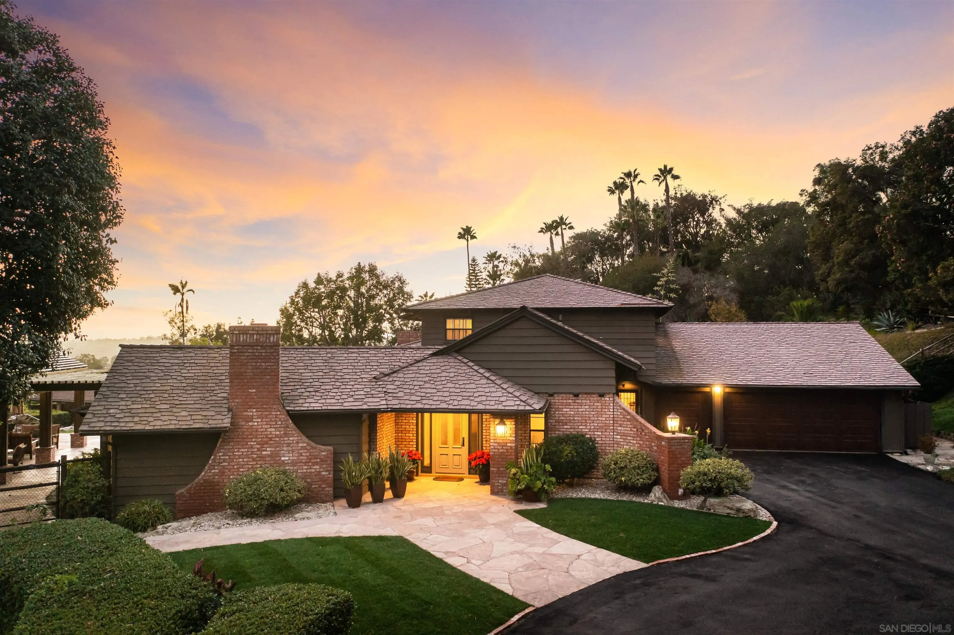 17136 El Mirador Rancho Santa Fe, CA 92067 - Photo 12 of 58 a view of a big house with a big yard and potted plants