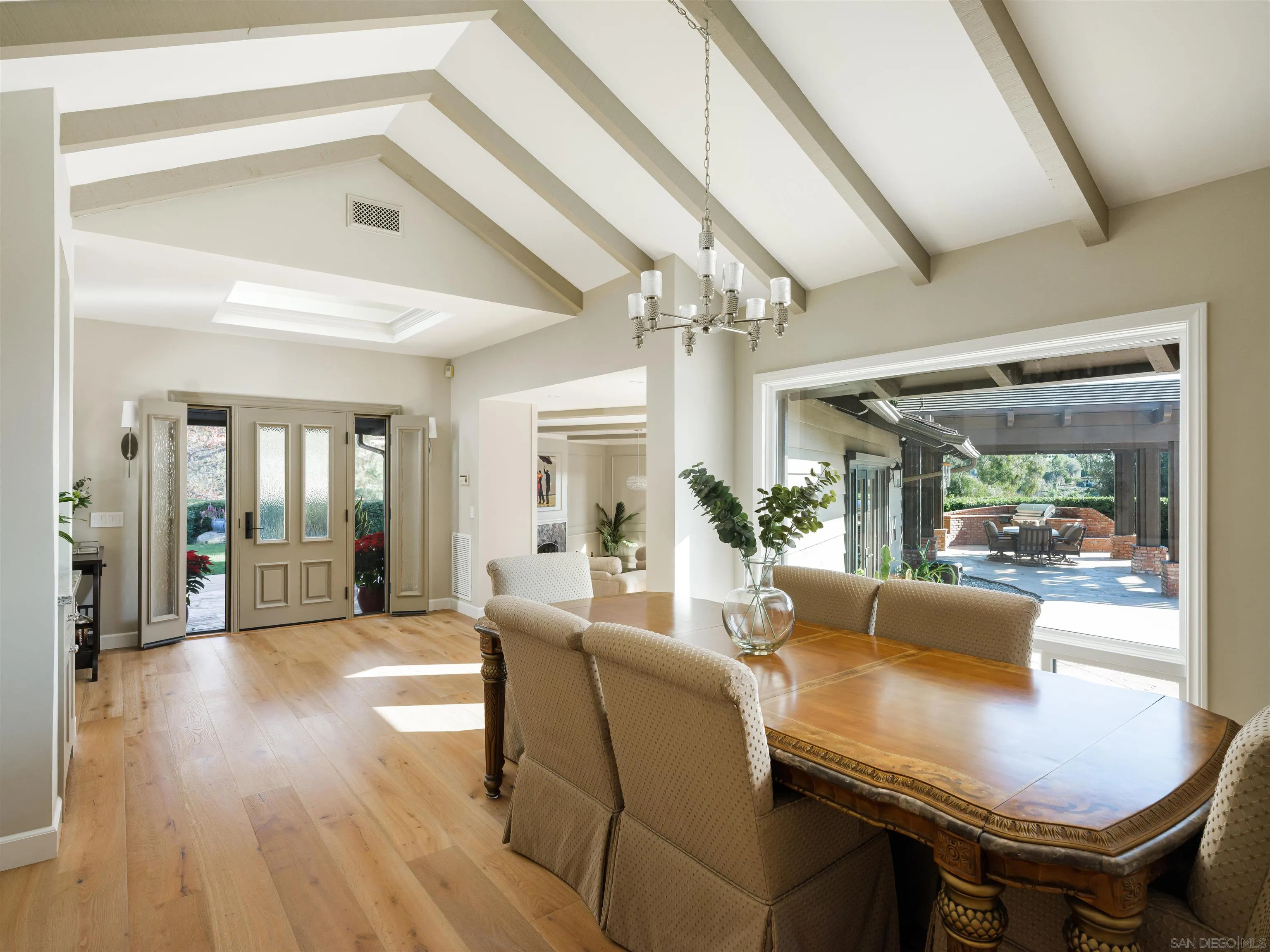 17136 El Mirador Rancho Santa Fe, CA 92067 - Photo 20 of 58 a living room with furniture and a chandelier