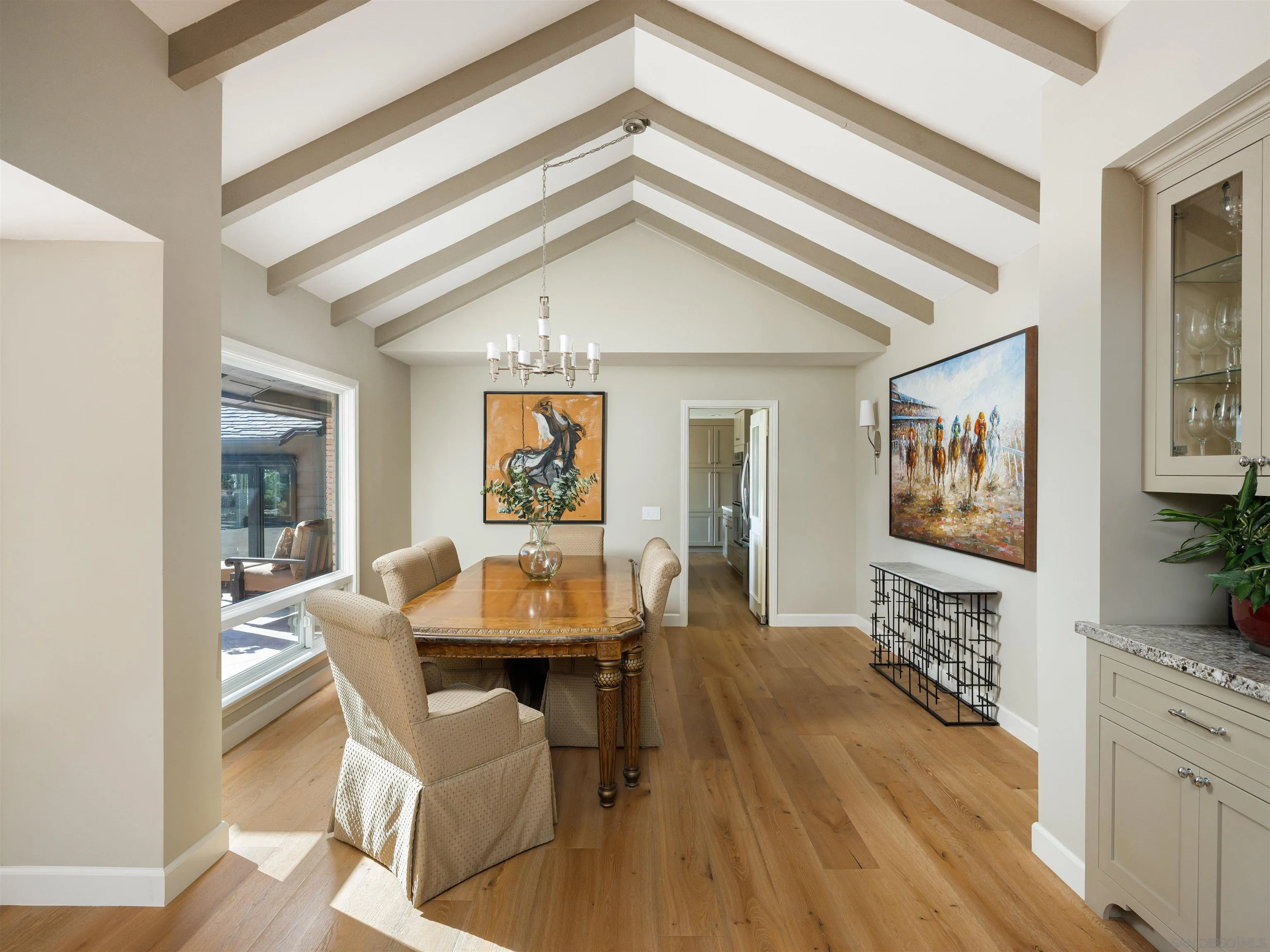 17136 El Mirador Rancho Santa Fe, CA 92067 - Photo 21 of 58 a view of a dining room with furniture and wooden floor