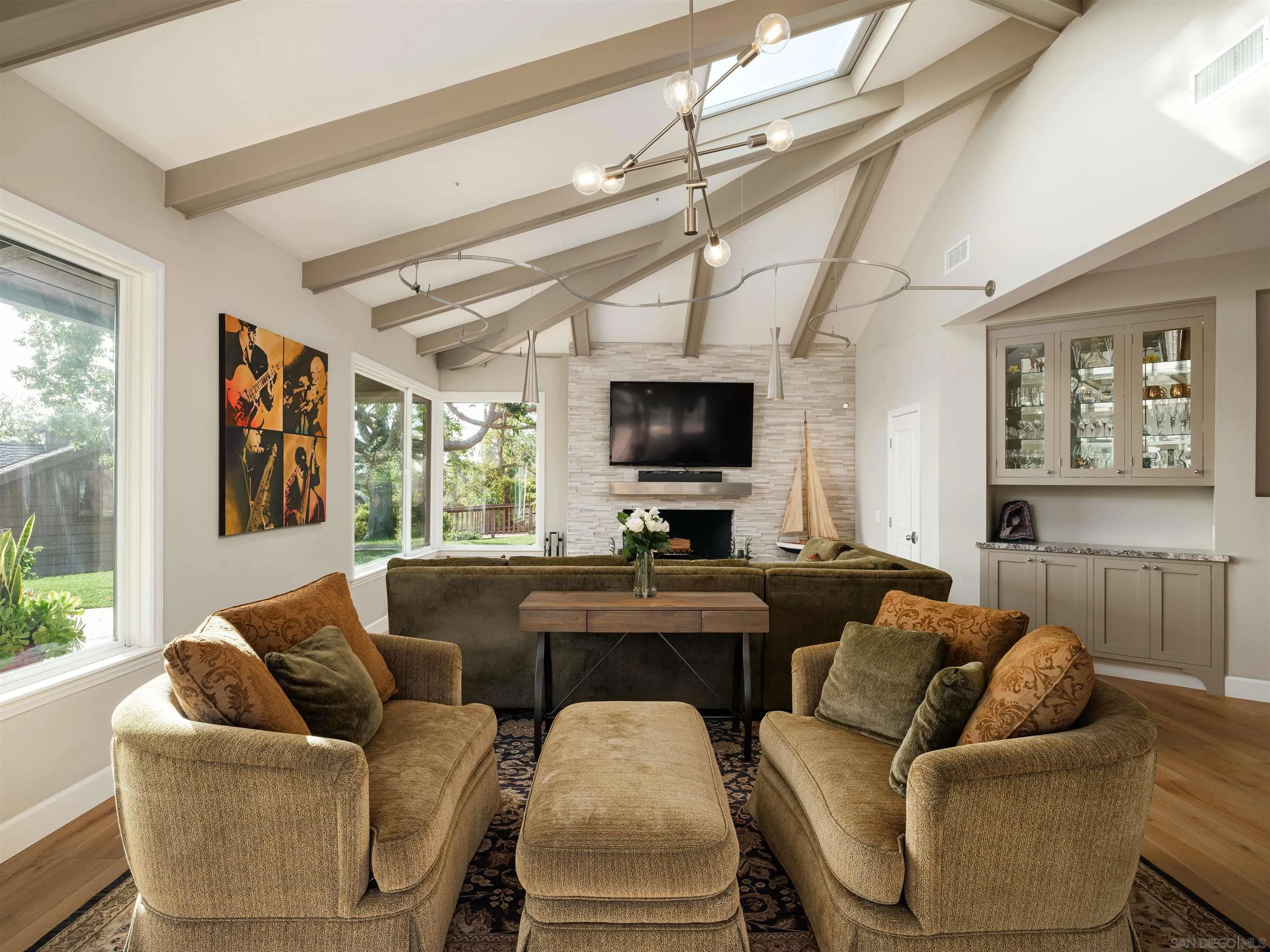17136 El Mirador Rancho Santa Fe, CA 92067 - Photo 27 of 58 a living room with furniture a flat screen tv and a large window