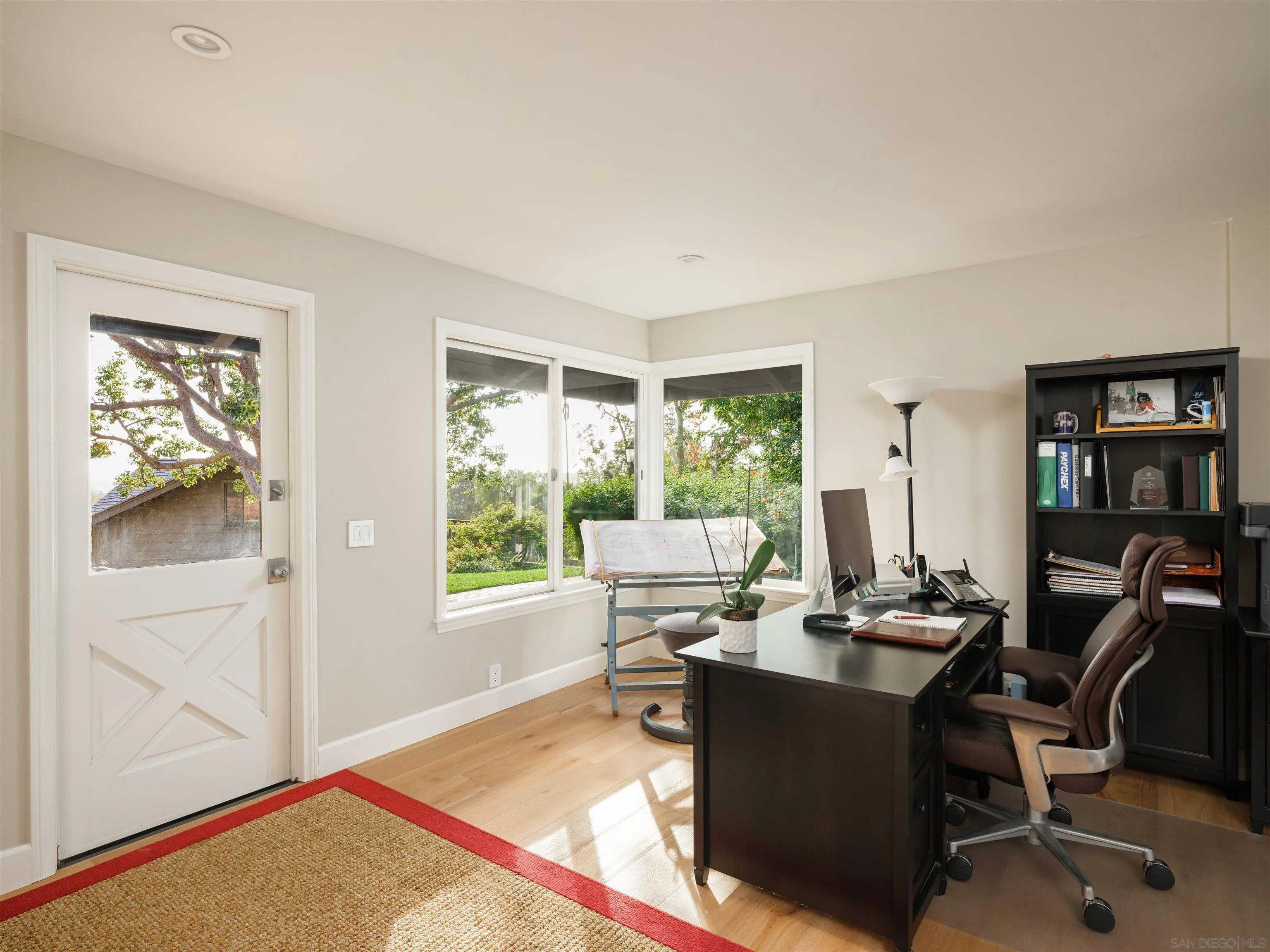17136 El Mirador Rancho Santa Fe, CA 92067 - Photo 29 of 58 a view of a workspace with furniture and a window