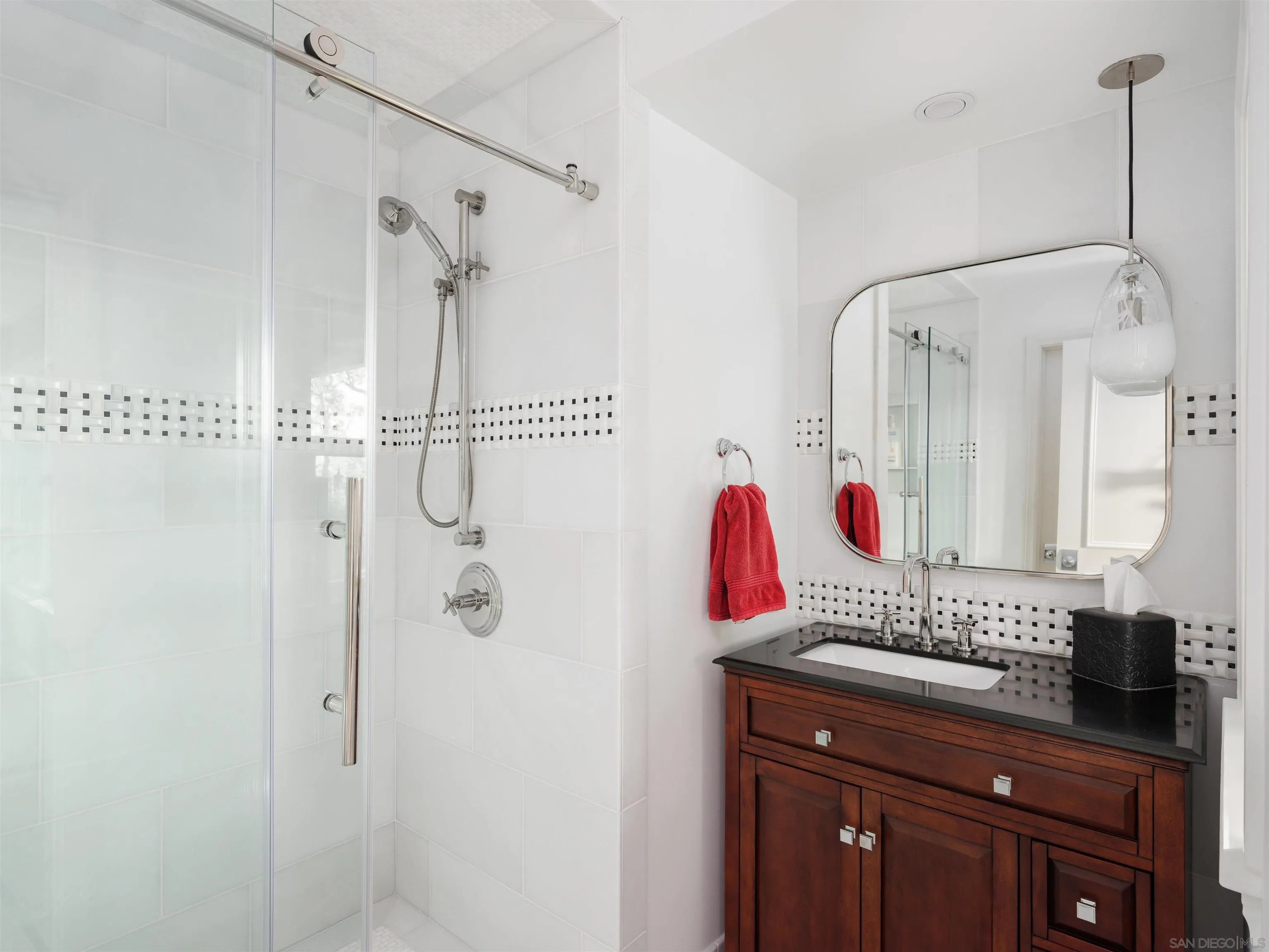 17136 El Mirador Rancho Santa Fe, CA 92067 - Photo 30 of 58 a bathroom with a sink and a mirror