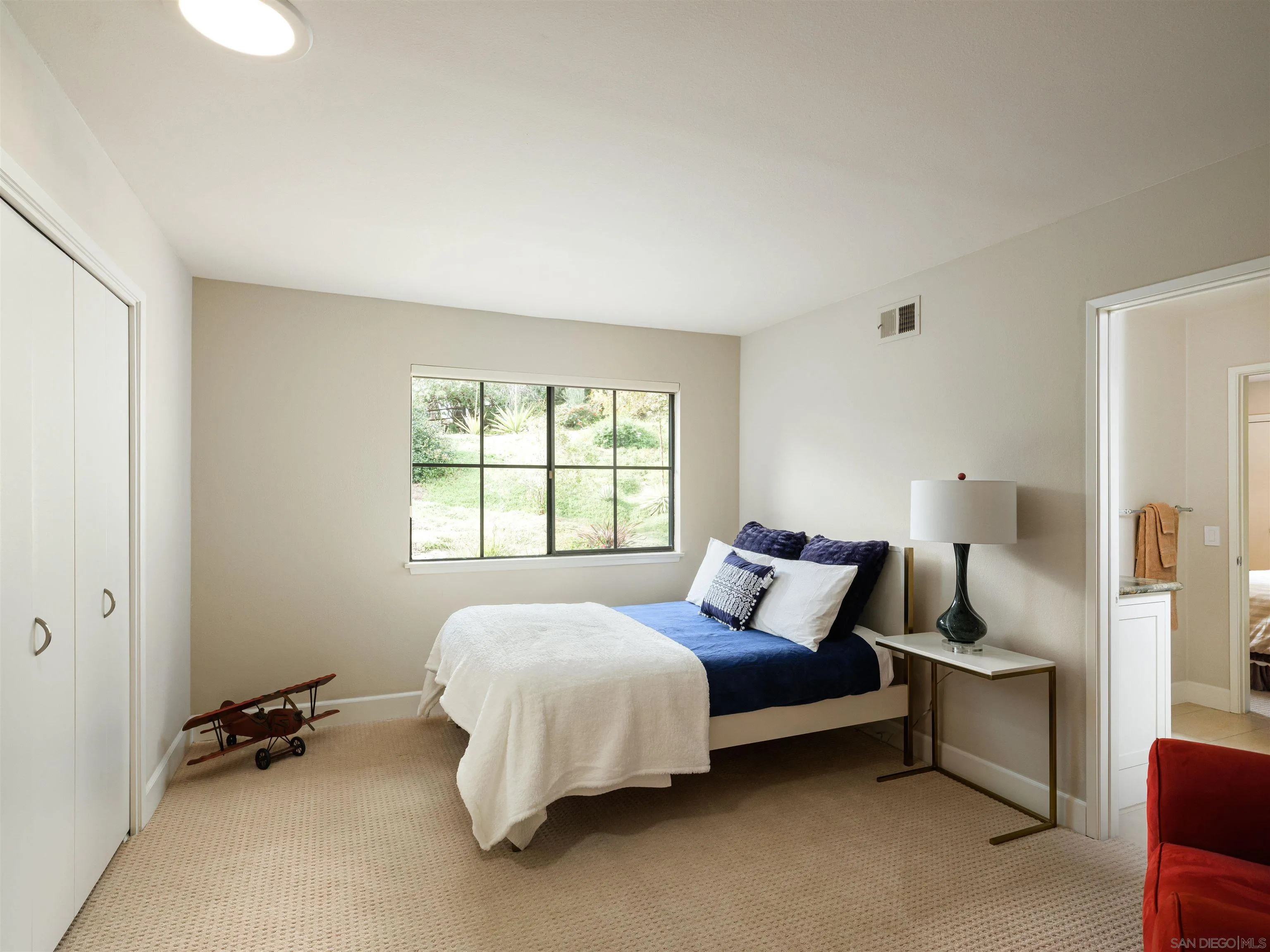 17136 El Mirador Rancho Santa Fe, CA 92067 - Photo 31 of 58 a bedroom with a bed and a window