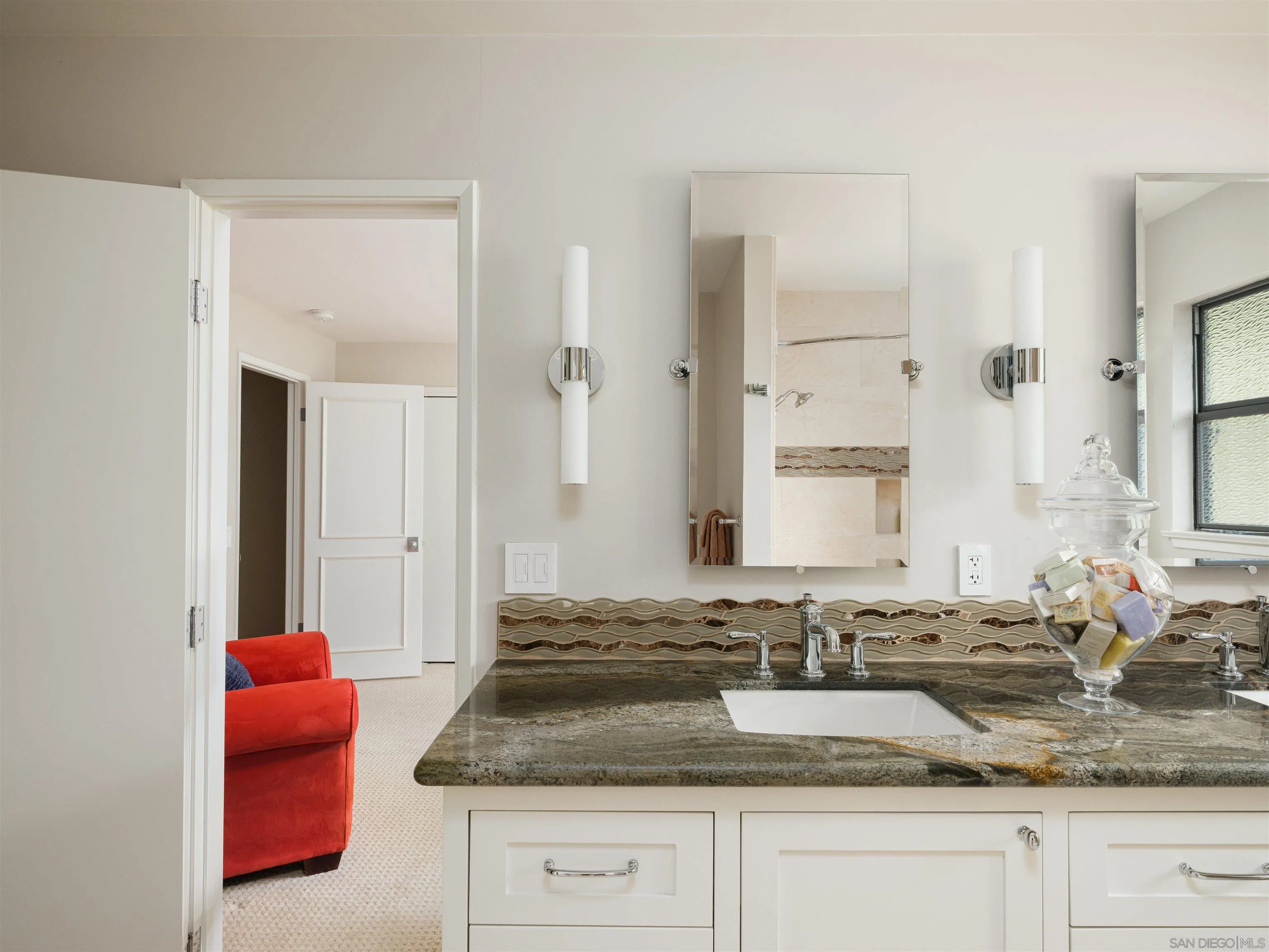 17136 El Mirador Rancho Santa Fe, CA 92067 - Photo 32 of 58 a bathroom with granite countertop a sink and a mirror