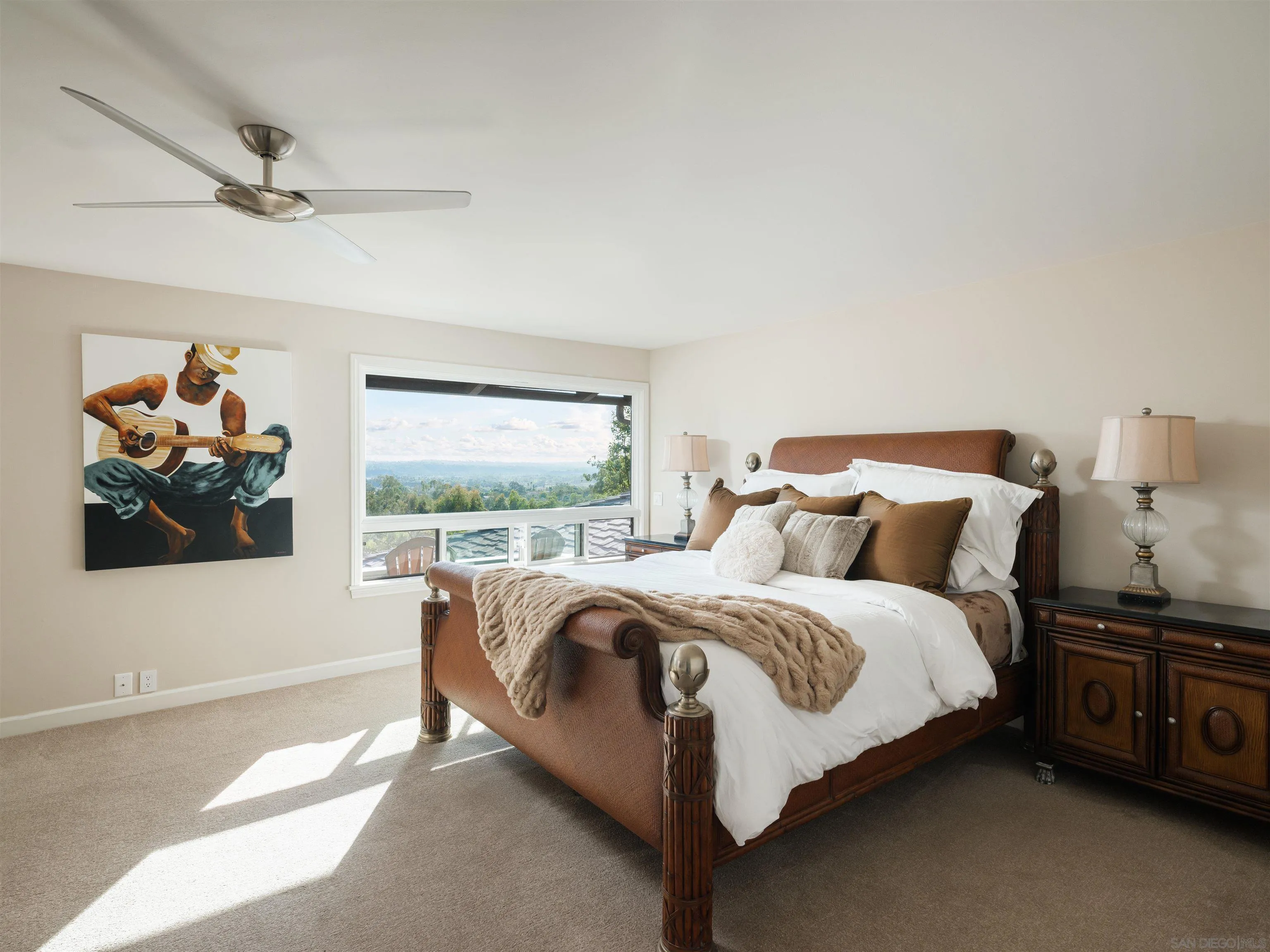 17136 El Mirador Rancho Santa Fe, CA 92067 - Photo 35 of 58 a bed sitting in a bedroom next to a window