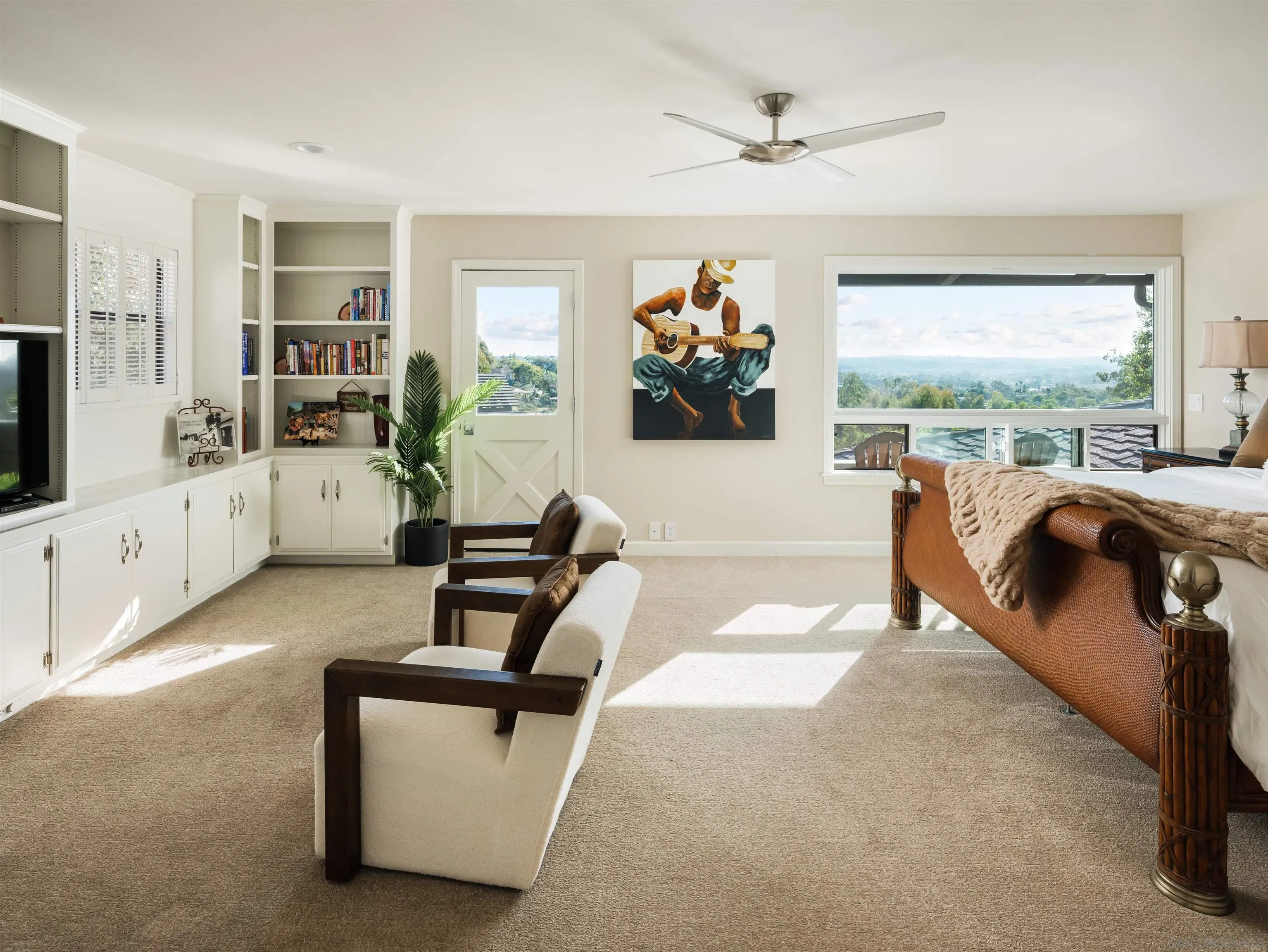 17136 El Mirador Rancho Santa Fe, CA 92067 - Photo 36 of 58 a living room with furniture and a flat screen tv
