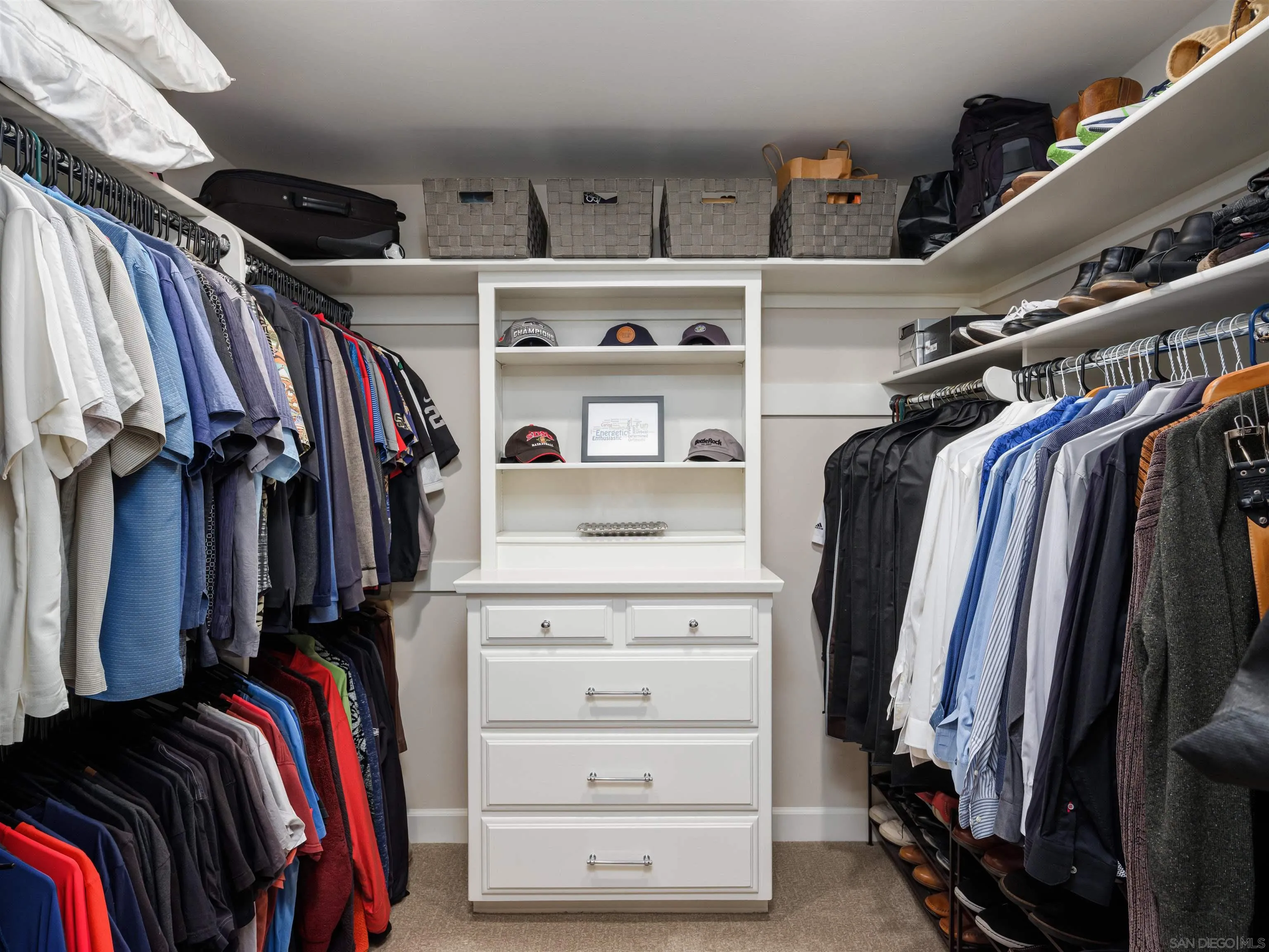 17136 El Mirador Rancho Santa Fe, CA 92067 - Photo 40 of 58 a view of walk in closet with clothes and shoes