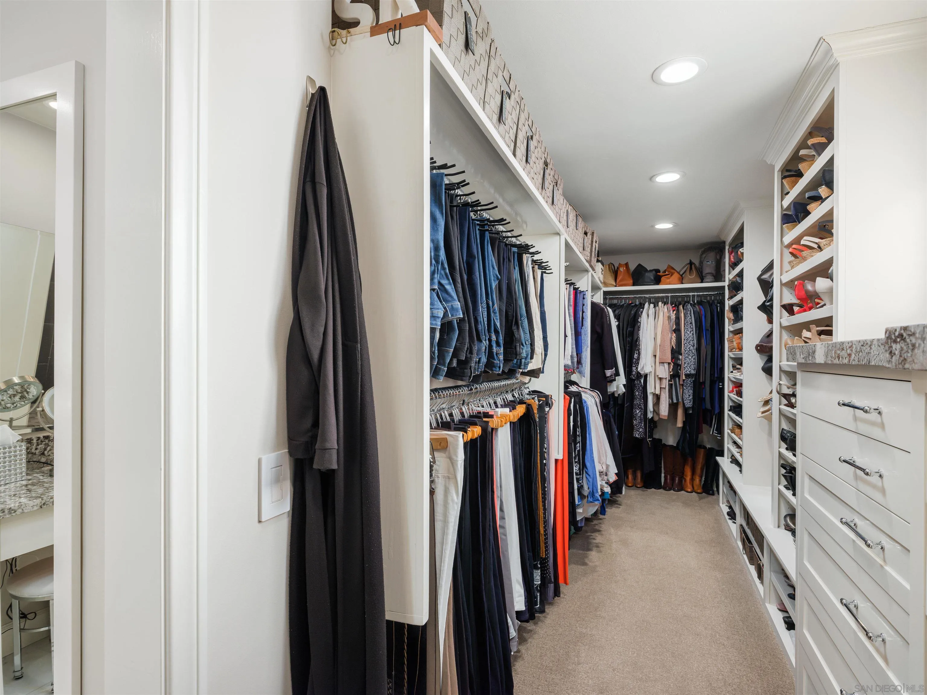 17136 El Mirador Rancho Santa Fe, CA 92067 - Photo 42 of 58 a view of walk in closet with clothes