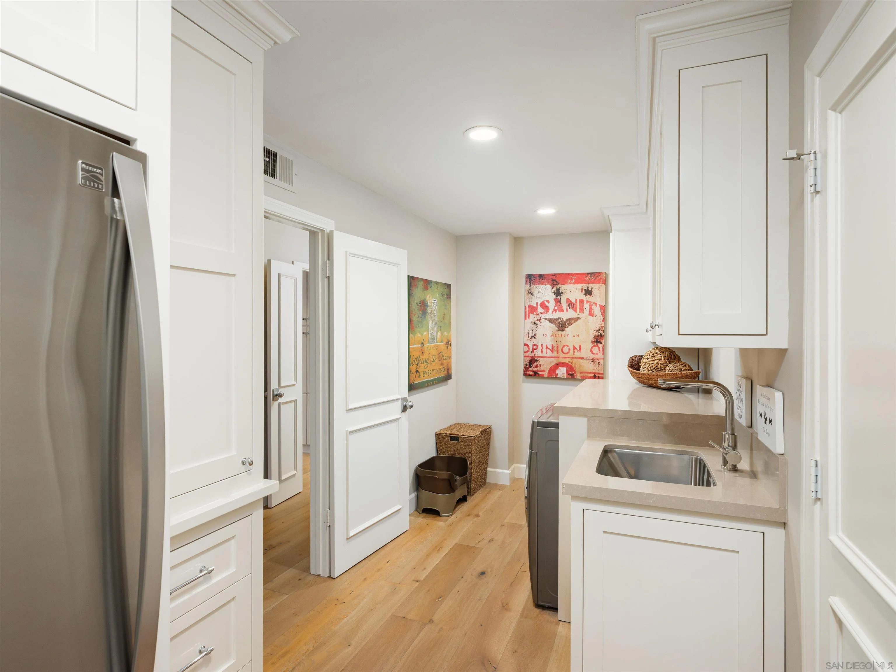 17136 El Mirador Rancho Santa Fe, CA 92067 - Photo 44 of 58 a kitchen with a refrigerator and a sink