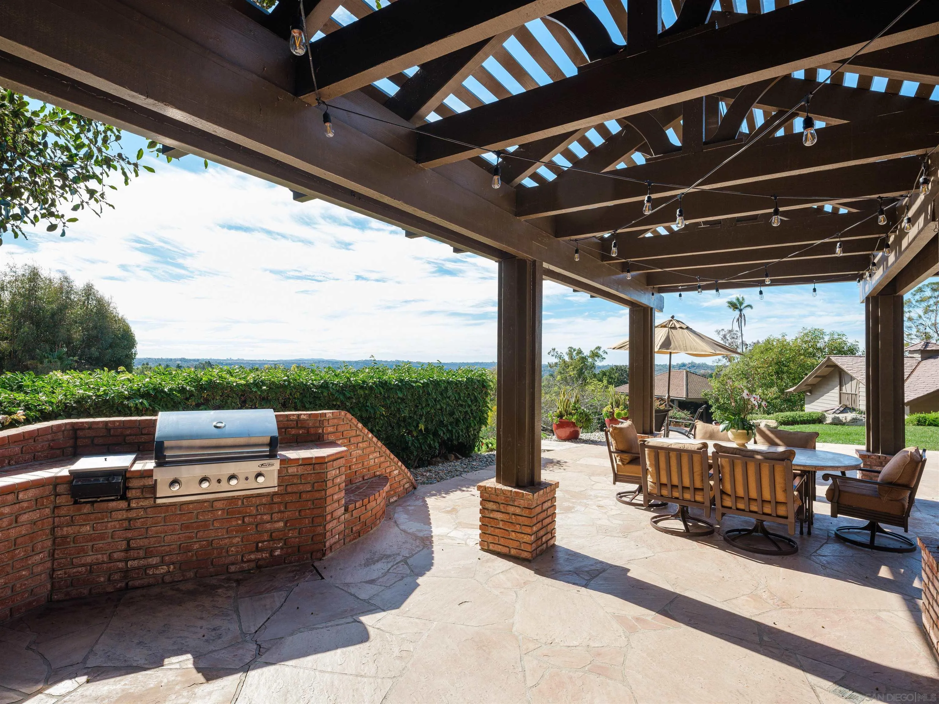 17136 El Mirador Rancho Santa Fe, CA 92067 - Photo 46 of 58 a view of a patio with couches chairs and a table