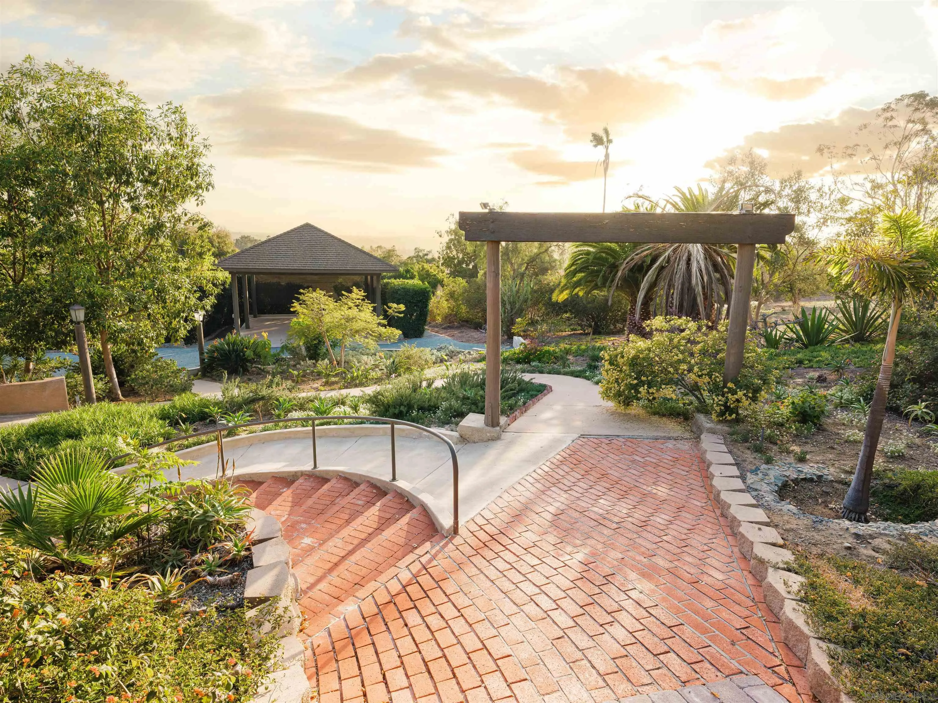 17136 El Mirador Rancho Santa Fe, CA 92067 - Photo 7 of 58 a view of a terrace with a bench