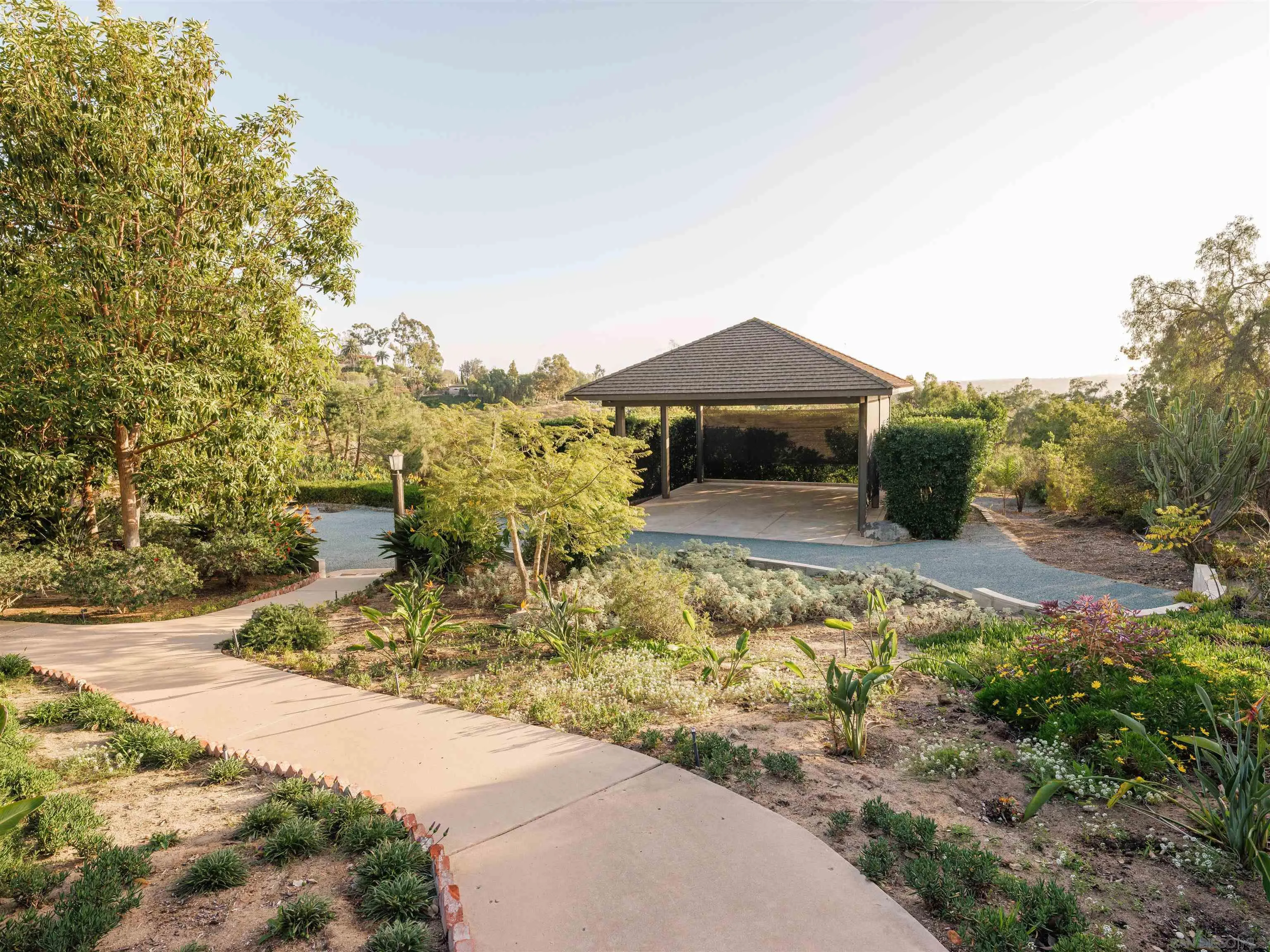 17136 El Mirador Rancho Santa Fe, CA 92067 - Photo 8 of 58 a view of a house with a yard