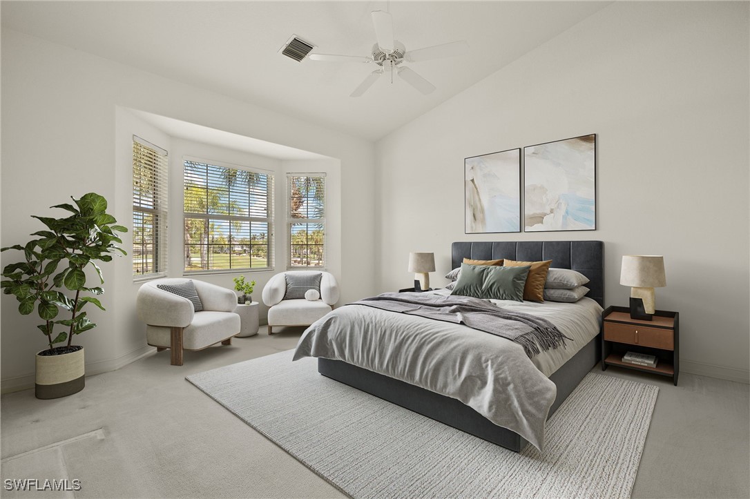 6035 Trophy Drive, Unit 103 Naples, FL 34110 - Photo 22 of 44 a bedroom with a large bed and a couch