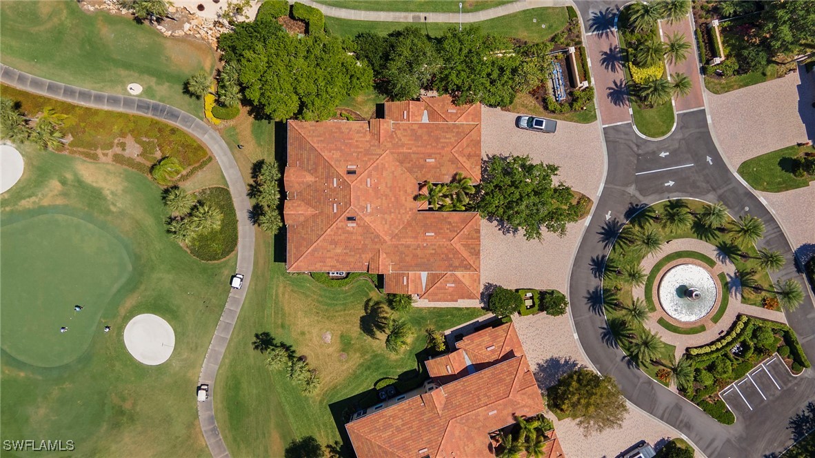 6035 Trophy Drive, Unit 103 Naples, FL 34110 - Photo 36 of 44 an aerial view of a house with a swimming pool garden and outdoor seating
