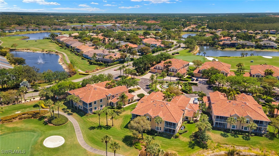 6035 Trophy Drive, Unit 103 Naples, FL 34110 - Photo 39 of 44 an aerial view of residential houses with outdoor space