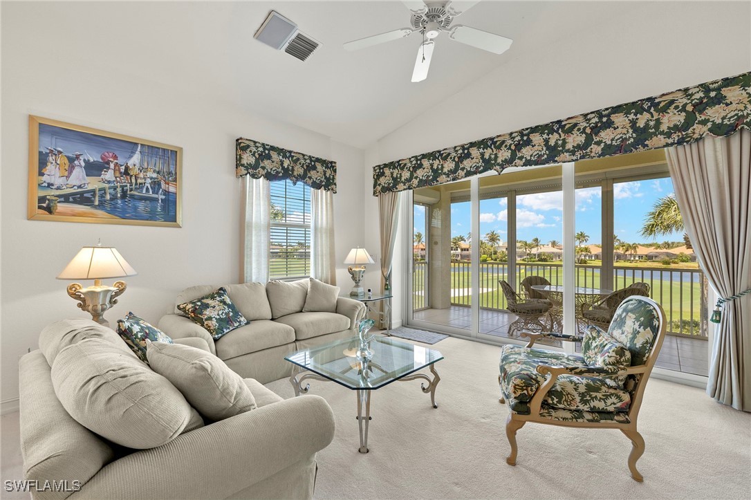 6035 Trophy Drive, Unit 103 Naples, FL 34110 - Photo 4 of 44 a living room with furniture and a large window