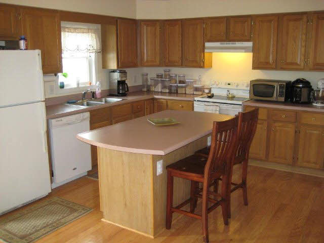 2171 Whispering Springs Road Harrisonburg, VA 22801 - Photo 2 of 11 a kitchen with a dining table chairs and a window