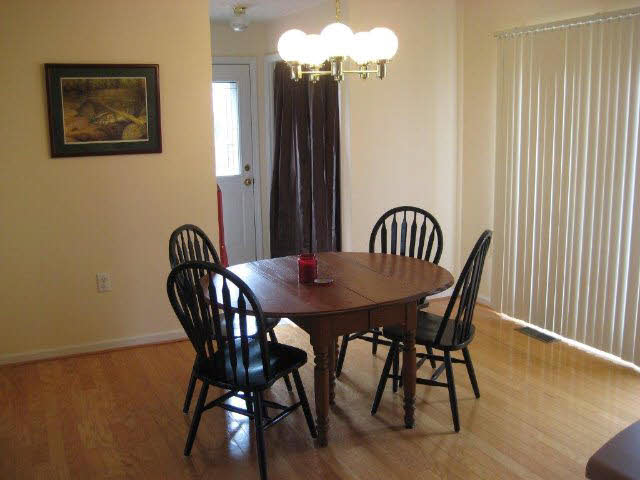2171 Whispering Springs Road Harrisonburg, VA 22801 - Photo 4 of 11 a view of a dining room with furniture and wooden floor