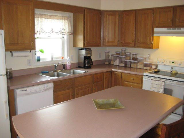 2171 Whispering Springs Road Harrisonburg, VA 22801 - Photo 5 of 11 a kitchen with a sink a window and cabinets