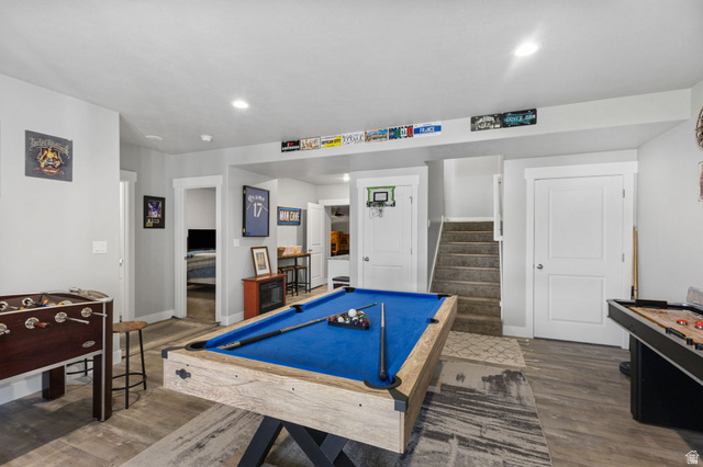 7889 Bristlecone Road Eagle Mountain, UT 84005 - Photo 28 of 42 Spacious recreation area featuring wood-finish flooring, recessed lighting, and white trim