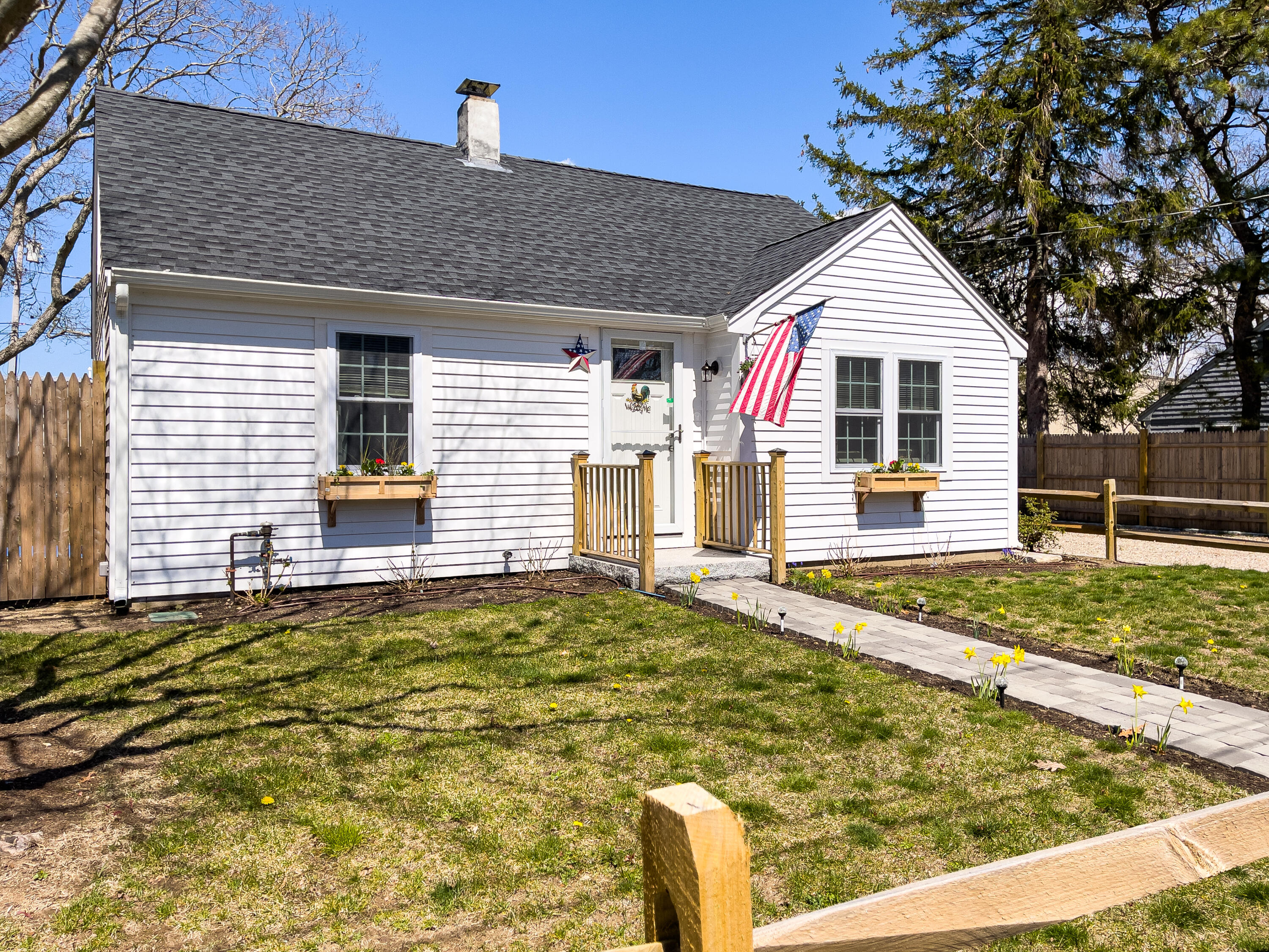 15 Brookshire Road Hyannis, MA 02601 - Photo 1 of 33 a view of a white house with a small yard and a large tree