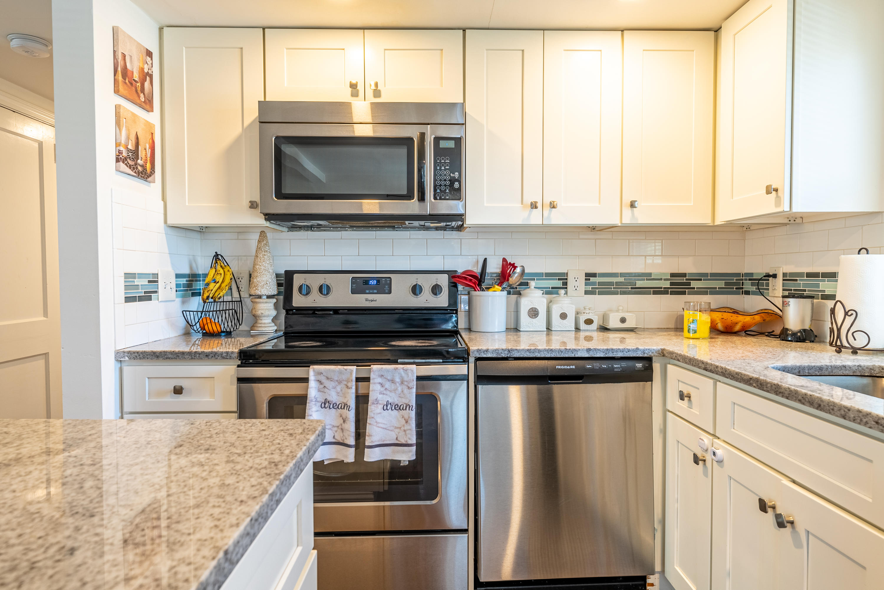 15 Brookshire Road Hyannis, MA 02601 - Photo 13 of 33 a kitchen with stainless steel appliances granite countertop a stove a sink and a microwave
