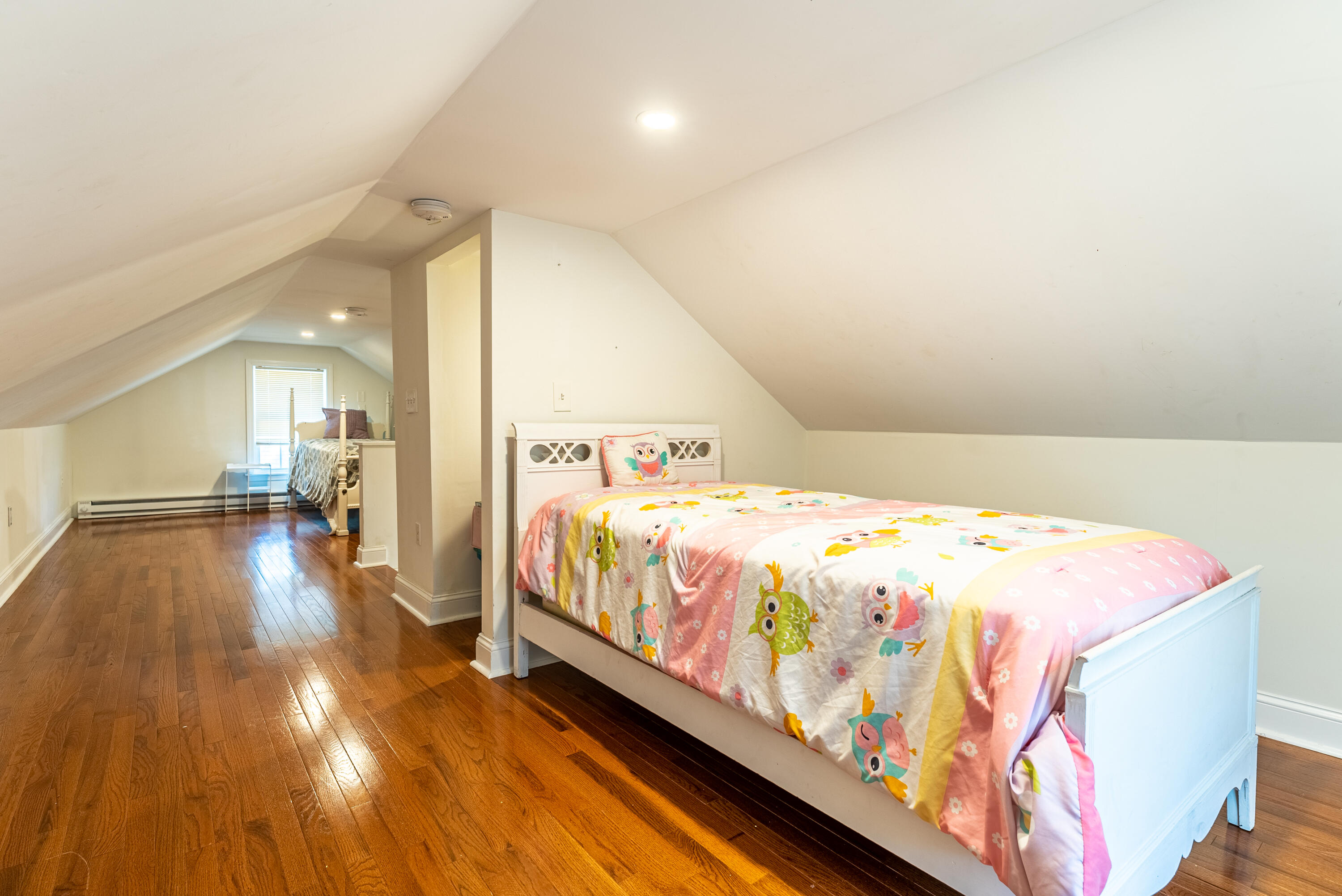 15 Brookshire Road Hyannis, MA 02601 - Photo 25 of 33 a bedroom with a bed and wooden floor