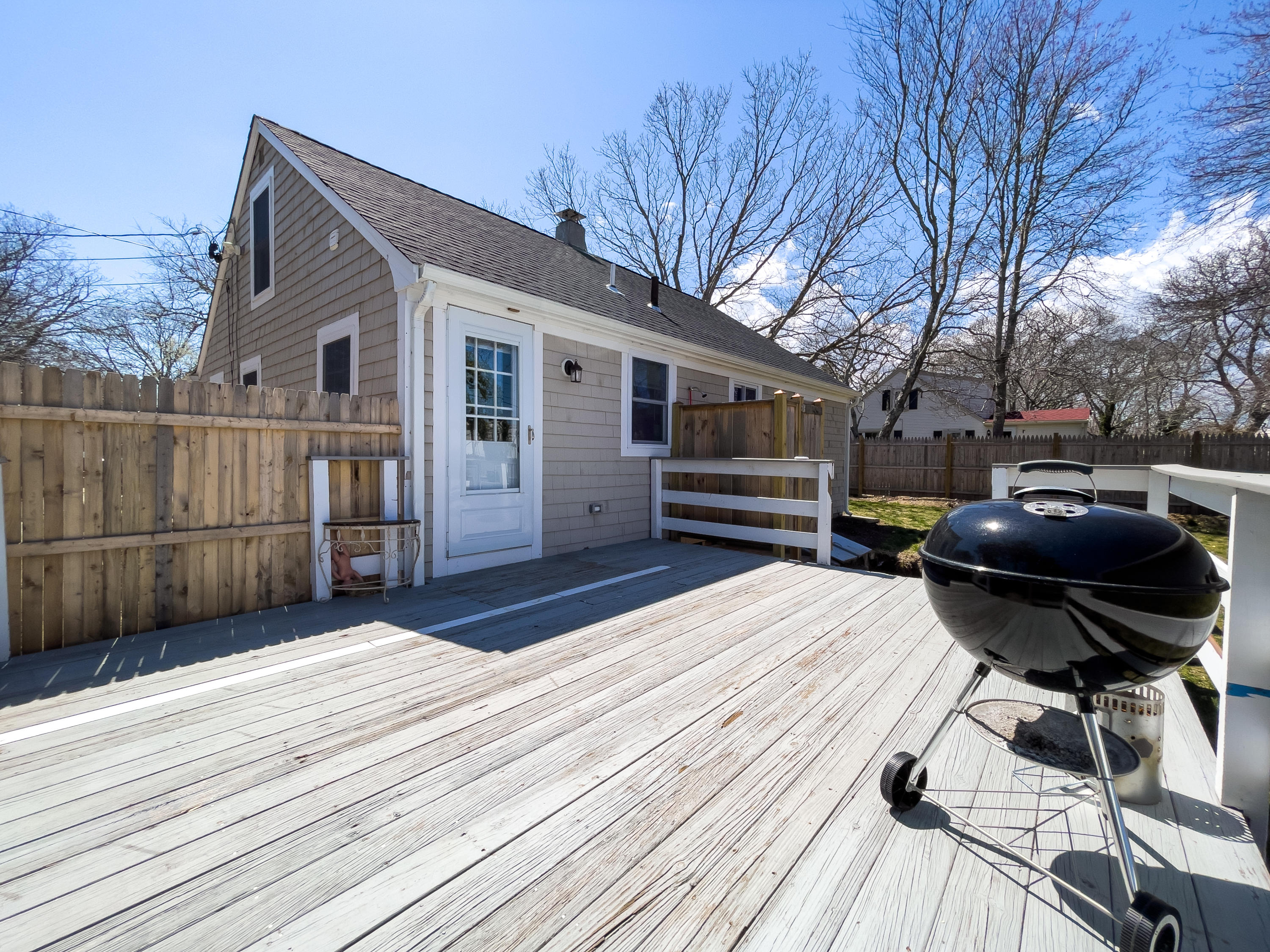15 Brookshire Road Hyannis, MA 02601 - Photo 30 of 33 a view of a house with a wooden bench
