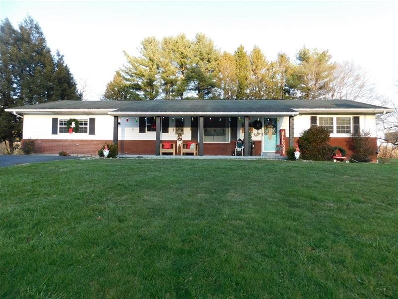 440 Mount Morris Road Mount Morris, PA 15349 - Photo 1 of 50 a front view of a house with a yard and trees