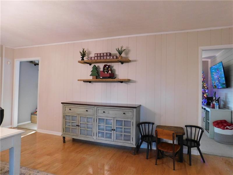 440 Mount Morris Road Mount Morris, PA 15349 - Photo 12 of 50 a view of a dining room with furniture and wooden floor