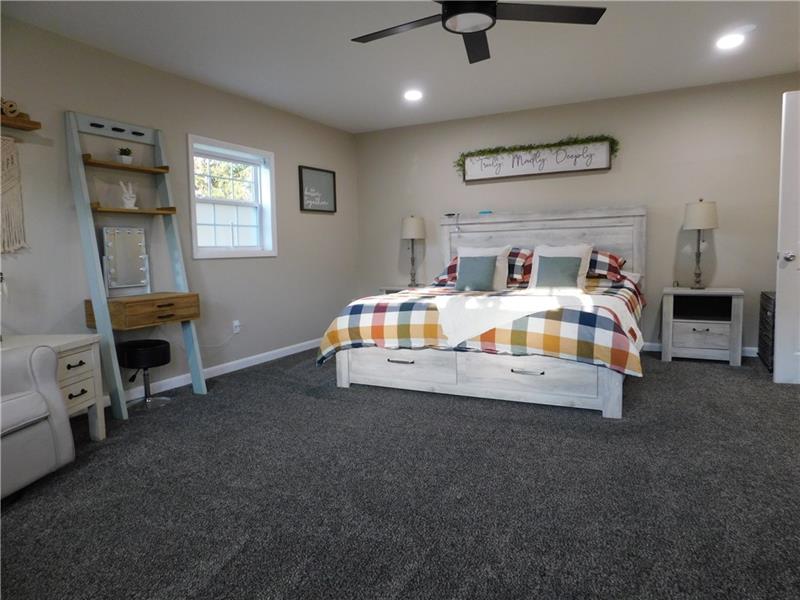 440 Mount Morris Road Mount Morris, PA 15349 - Photo 17 of 50 a room with bed and a tv