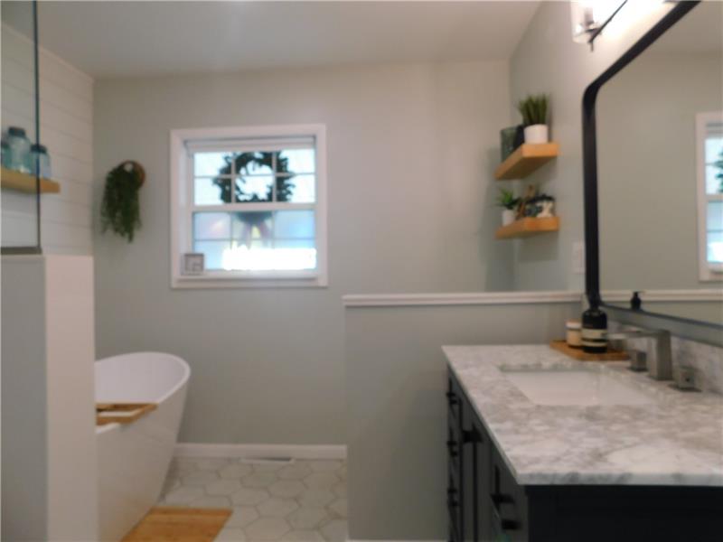 440 Mount Morris Road Mount Morris, PA 15349 - Photo 20 of 50 a bathroom with a granite countertop sink a toilet a window and mirror