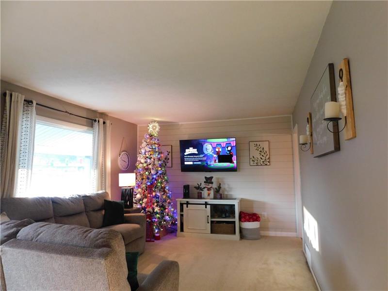 440 Mount Morris Road Mount Morris, PA 15349 - Photo 5 of 50 a living room with furniture and a flat screen tv