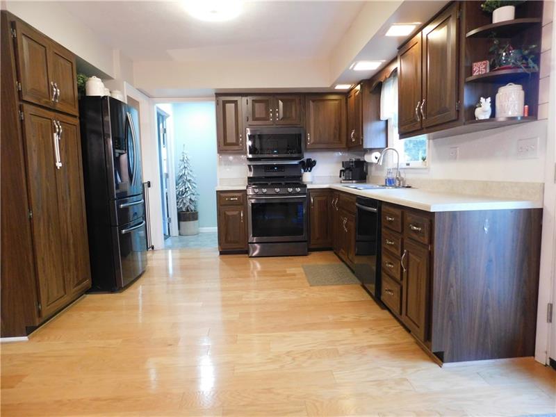 440 Mount Morris Road Mount Morris, PA 15349 - Photo 6 of 50 a kitchen with stainless steel appliances granite countertop a refrigerator stove and sink
