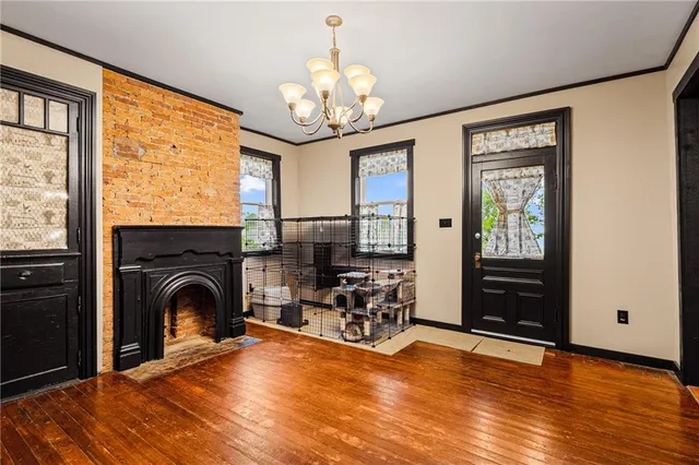 a view of livingroom with chandelier and furniture