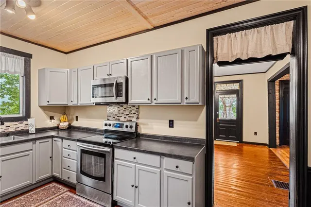 a spacious bathroom with a double vanity sink and a mirror