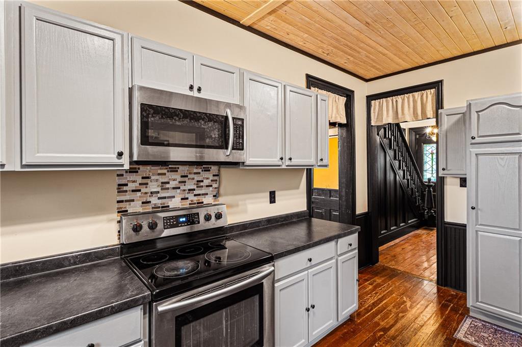 580 Green Valley Road Eighty Four, PA 15330 - Photo 19 of 45 a kitchen with stainless steel appliances a stove sink and microwave