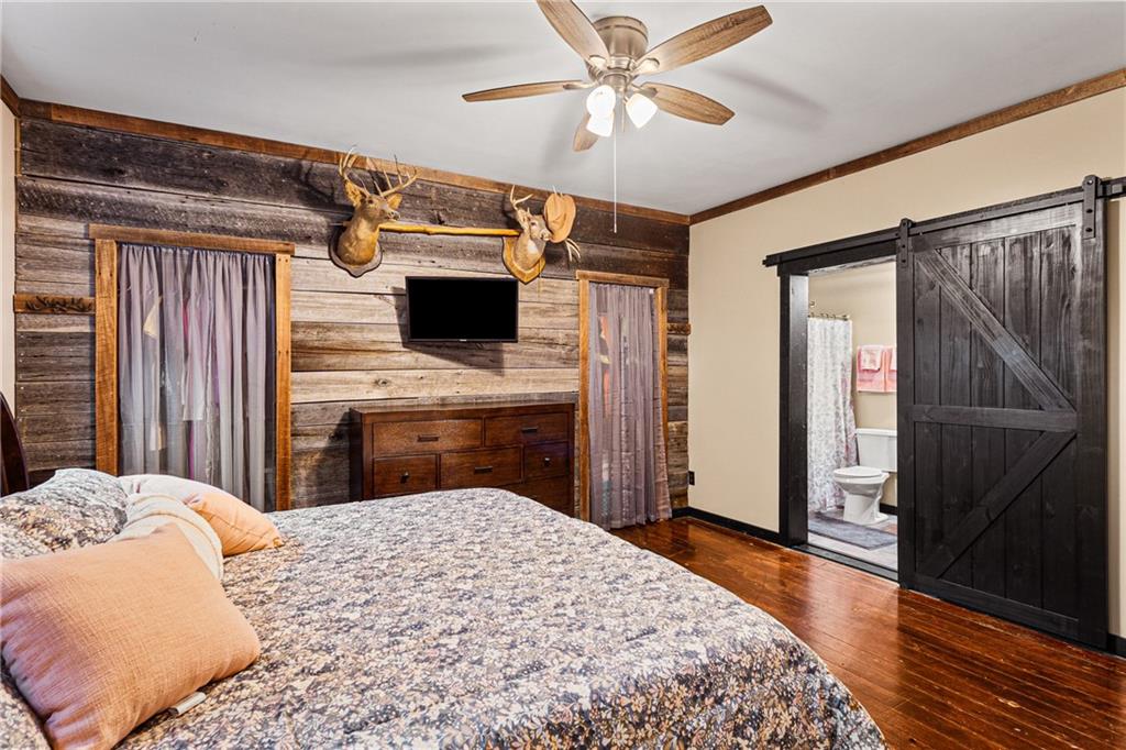 580 Green Valley Road Eighty Four, PA 15330 - Photo 20 of 45 a bedroom with a bed and a chandelier