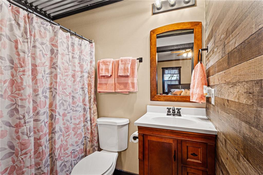 580 Green Valley Road Eighty Four, PA 15330 - Photo 22 of 45 a bathroom with a sink a toilet and shower curtain