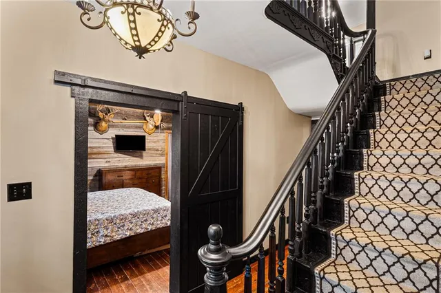 a view of empty room with fireplace and fan