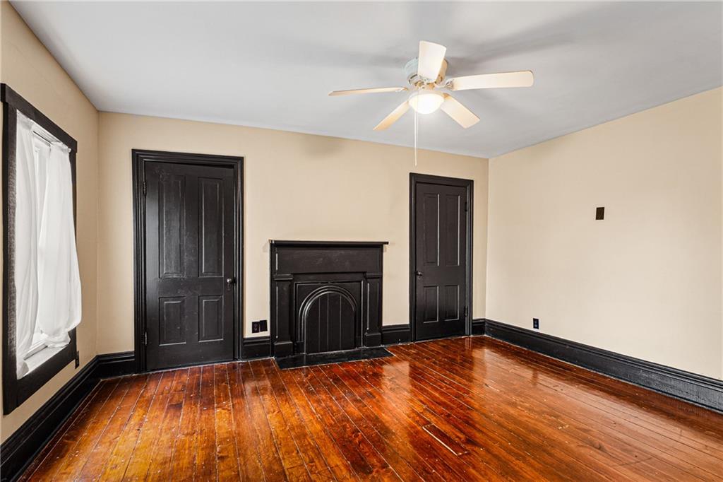 580 Green Valley Road Eighty Four, PA 15330 - Photo 24 of 45 a view of empty room with fireplace and fan