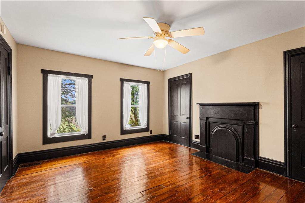 580 Green Valley Road Eighty Four, PA 15330 - Photo 25 of 45 a view of empty room with fireplace and wooden floor