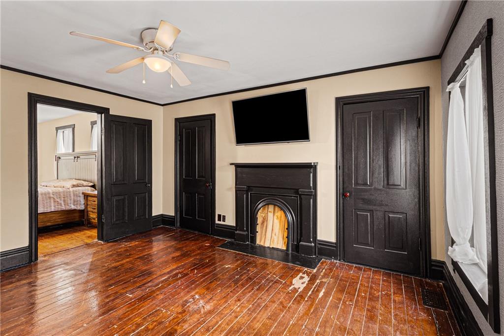 580 Green Valley Road Eighty Four, PA 15330 - Photo 26 of 45 a view of an empty room with wooden floor fireplace and a window