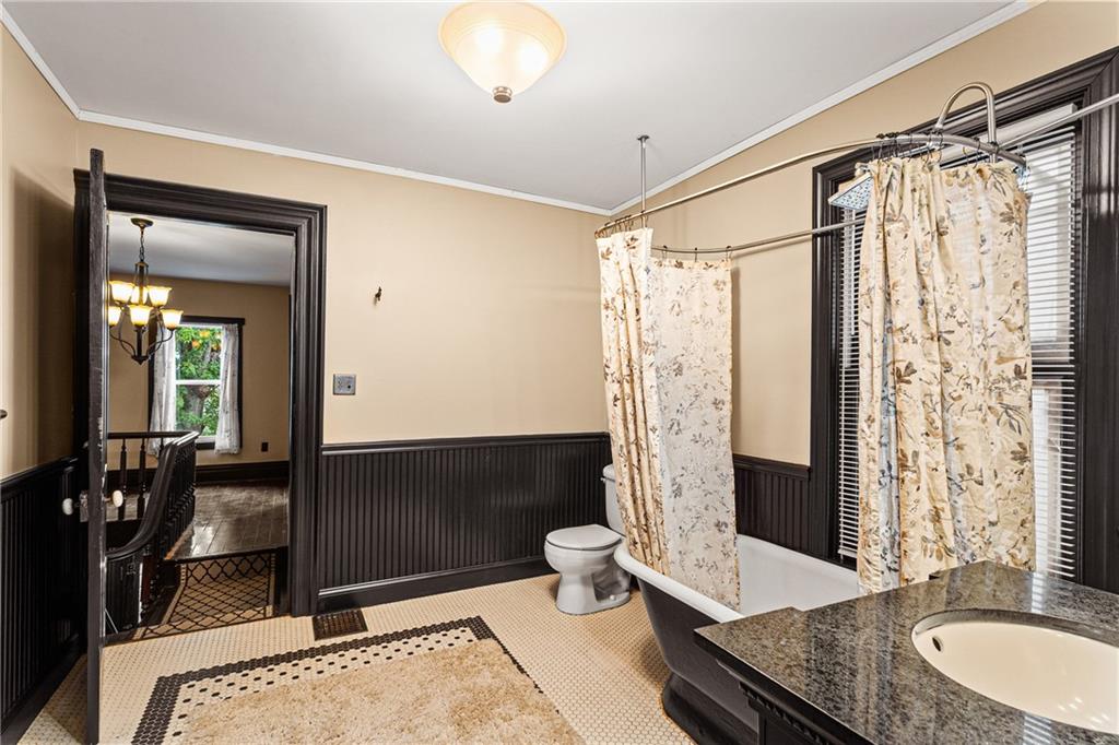 580 Green Valley Road Eighty Four, PA 15330 - Photo 32 of 45 a bathroom with a granite countertop sink a toilet a mirror and shower