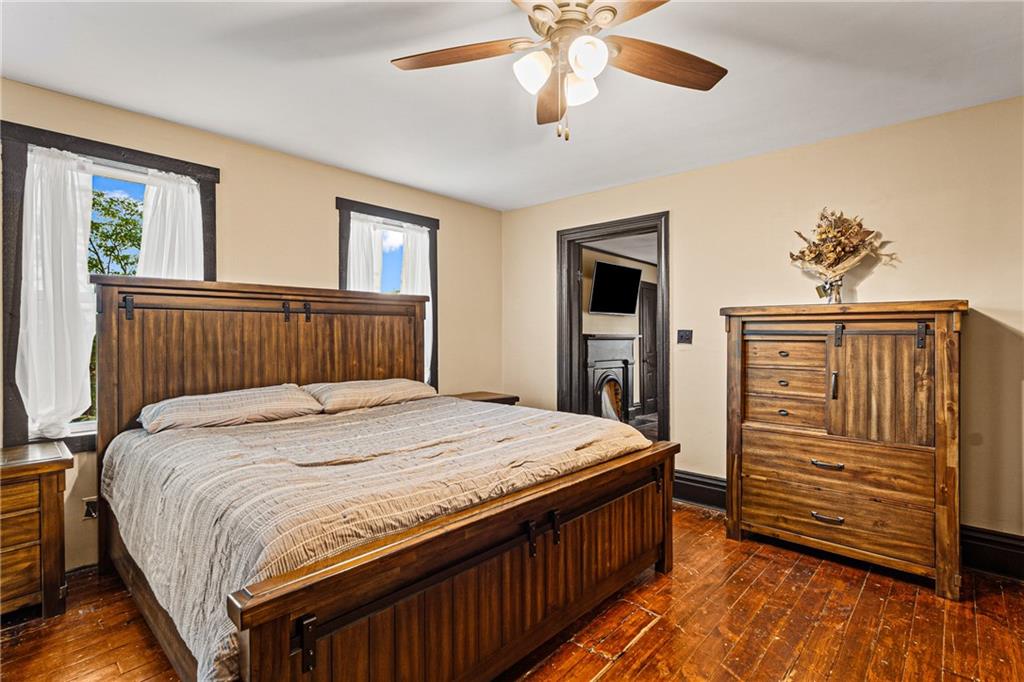 580 Green Valley Road Eighty Four, PA 15330 - Photo 35 of 45 a bedroom with a bed and wooden floor