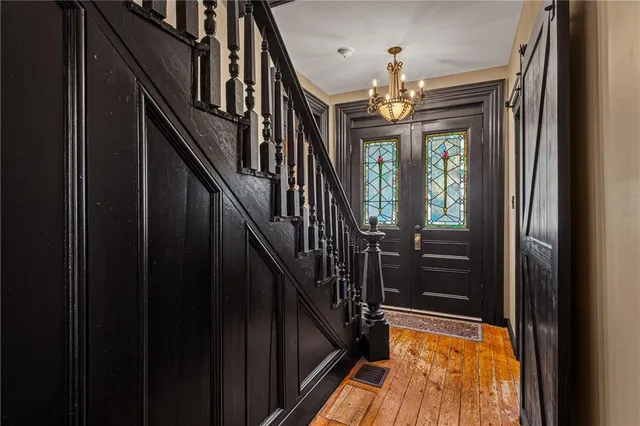 a bedroom with a bed and a fireplace