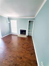 18333 Roehampton Drive, Unit 825 Dallas, TX 75252 - Photo 1 of 7 Living area featuring rich wood-finish flooring
